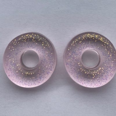 Donut rose pâle pailleté